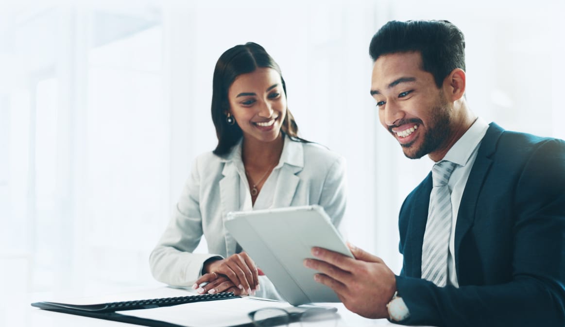 A man and a woman discussing a business savings acount