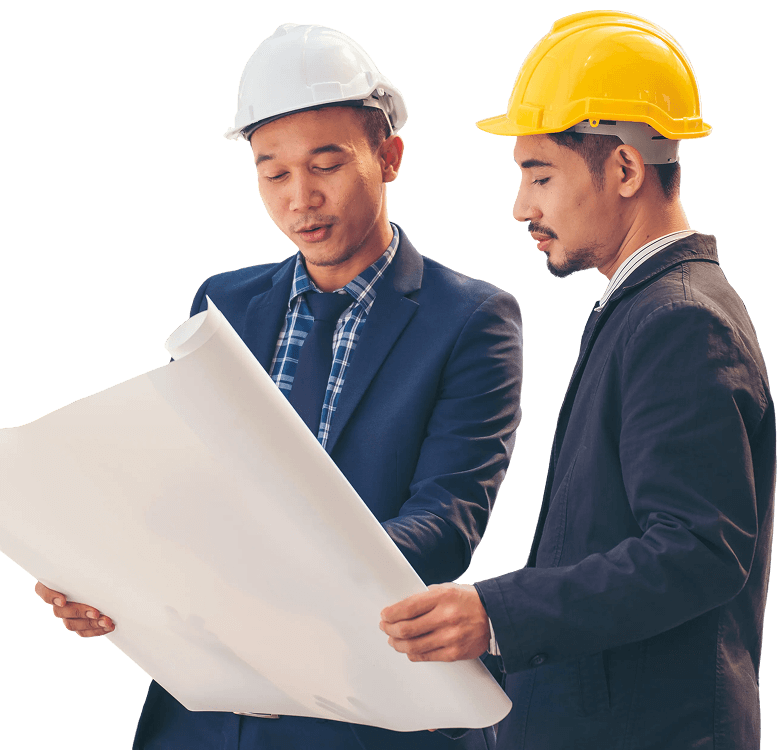 two men in hard hats looking at construction blueprints