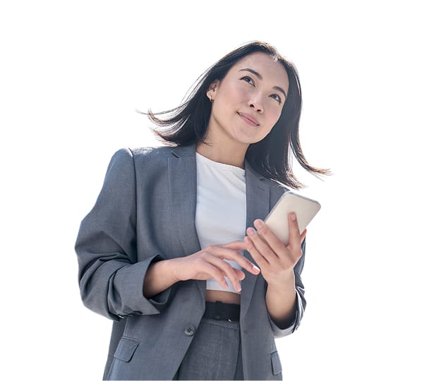 woman in a business suit holding a phone